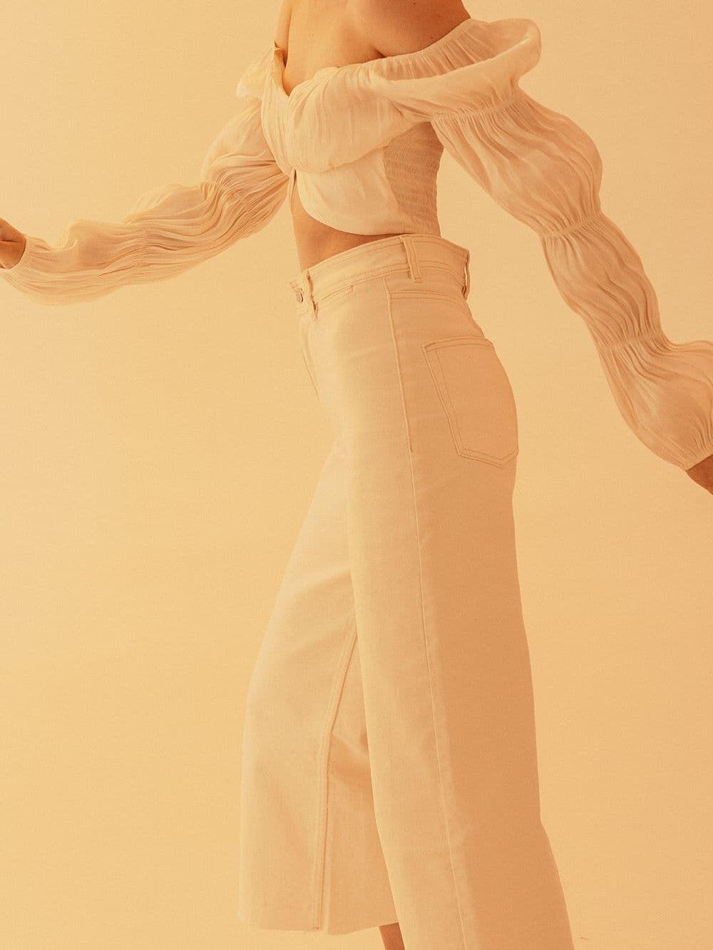 Editorial look in soft cream tailoring
