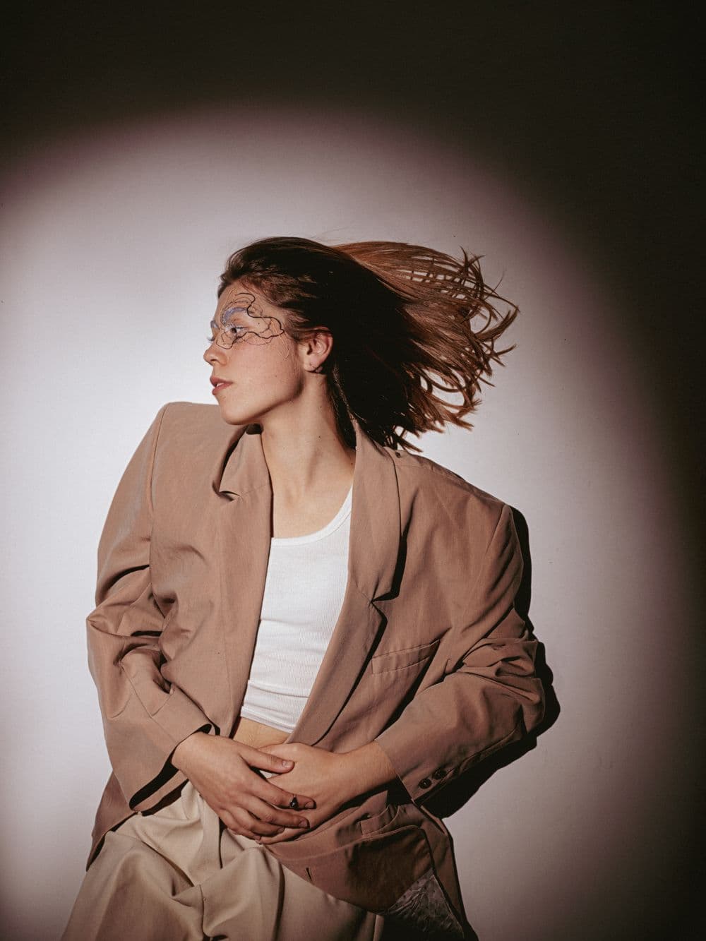 Model in an oversized camel blazer