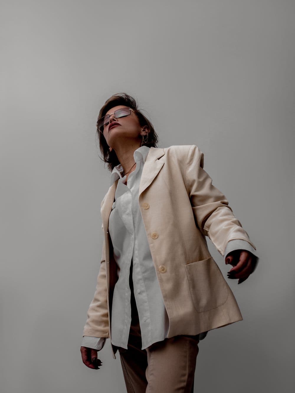 Model in a beige blazer and trousers